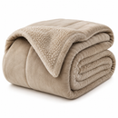 Folded beige blanket on a white background

